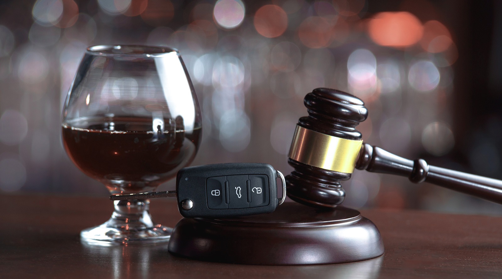 Gavel-alcohol-and-car-keys-on-wooden-table