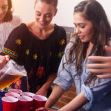 young-people-pouring-drinks-at-a-party
