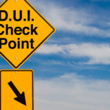 yellow-sign-indicating-a-DUI-checkpoint